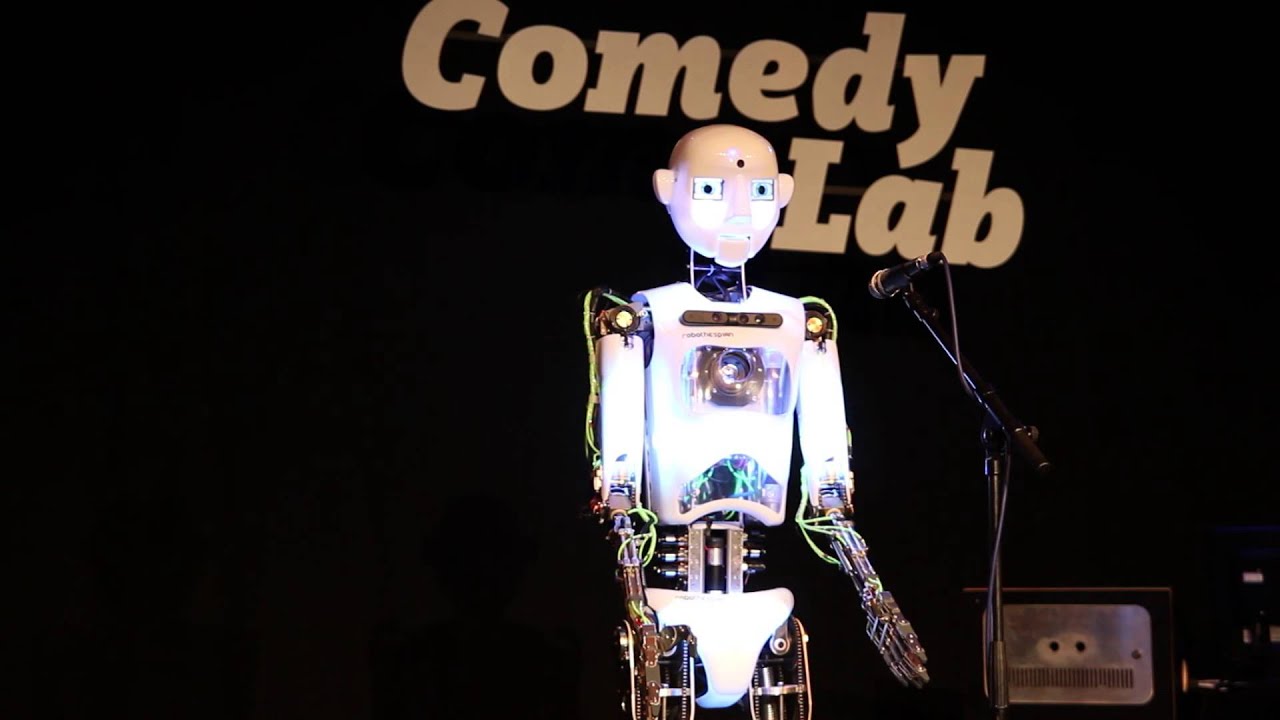 Robot attempting to perform stand-up comedy to a human audience