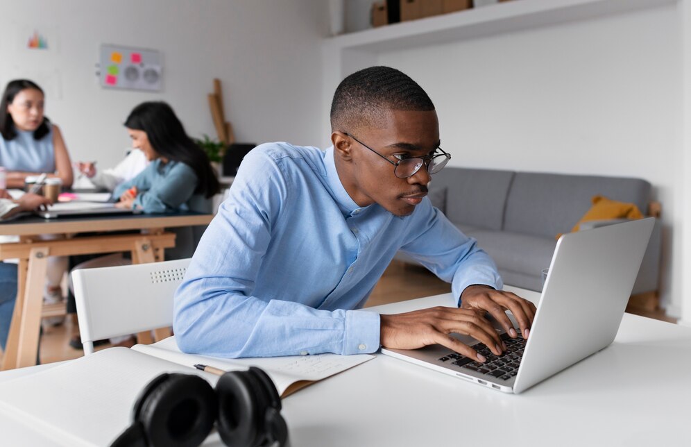 Student using laptop with AI writing tools
